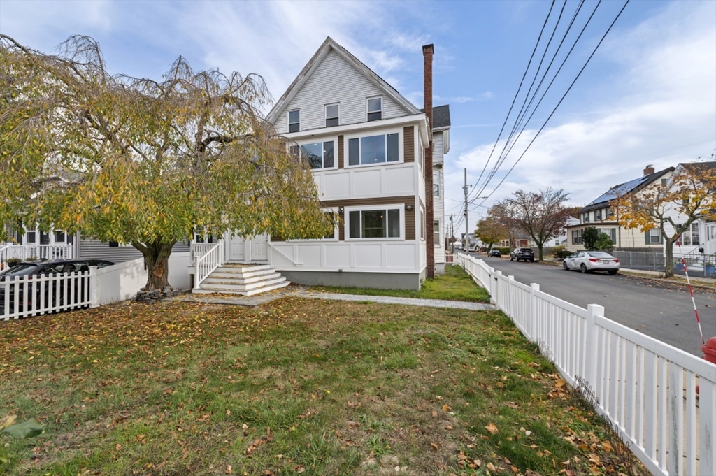 129 Lynnway, Unit 3 Revere, MA 02151 - Photo 10 of 14 a front view of a house with a yard