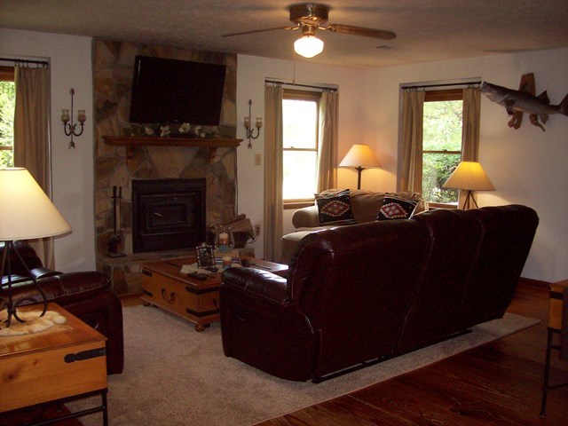 396 Buck Road Gray, GA 31032 - Photo 2 of 36 a living room with furniture a flat screen tv and a fireplace