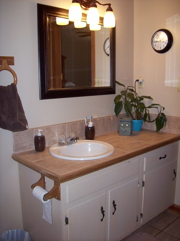 396 Buck Road Gray, GA 31032 - Photo 12 of 36 a bathroom with a sink and a mirror