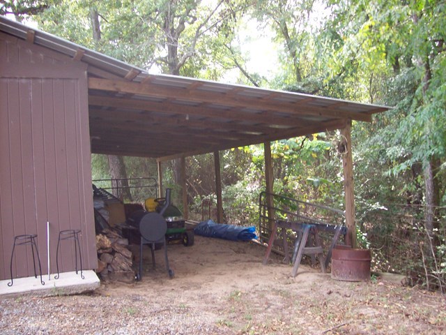 396 Buck Road Gray, GA 31032 - Photo 21 of 36 a backyard of a house with barbeque oven table and chairs