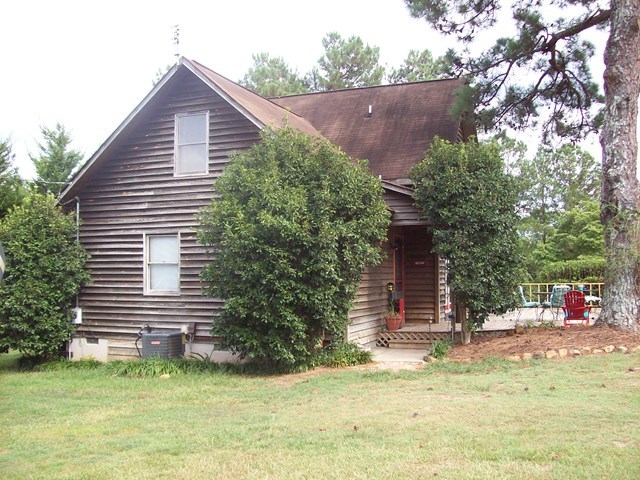 396 Buck Road Gray, GA 31032 - Photo 28 of 36 a view of a house with a yard and sitting area