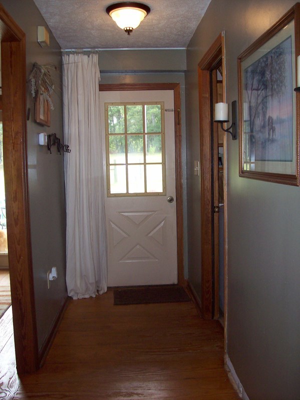 396 Buck Road Gray, GA 31032 - Photo 9 of 36 an empty room with wooden floor and windows