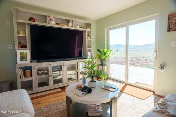 a spacious bedroom with a bed and a couch