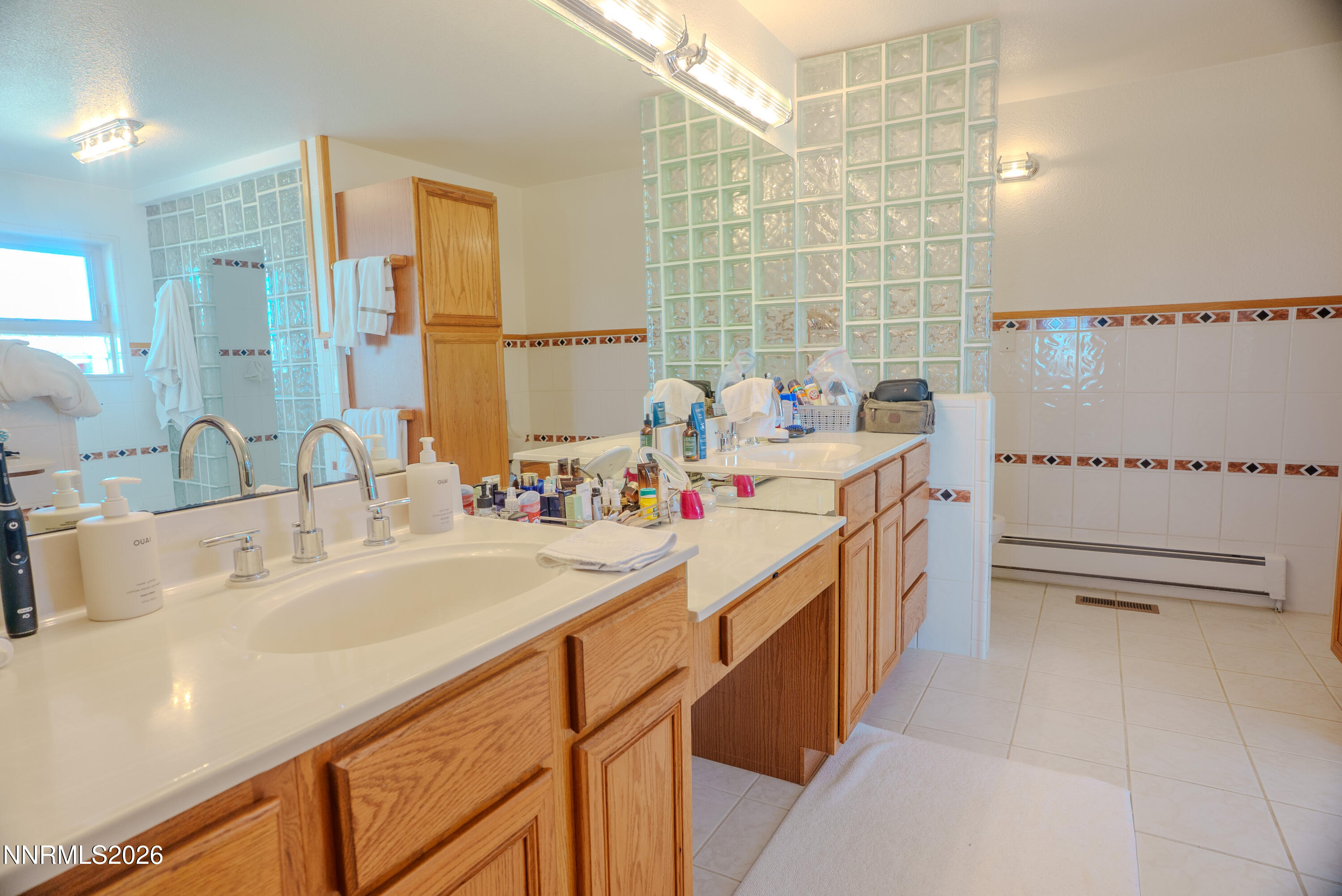 12000 North Red Rock Road Reno, NV 89508 - Photo 18 of 18 a view of a kitchen with a sink and dishwasher a refrigerator with white cabinets