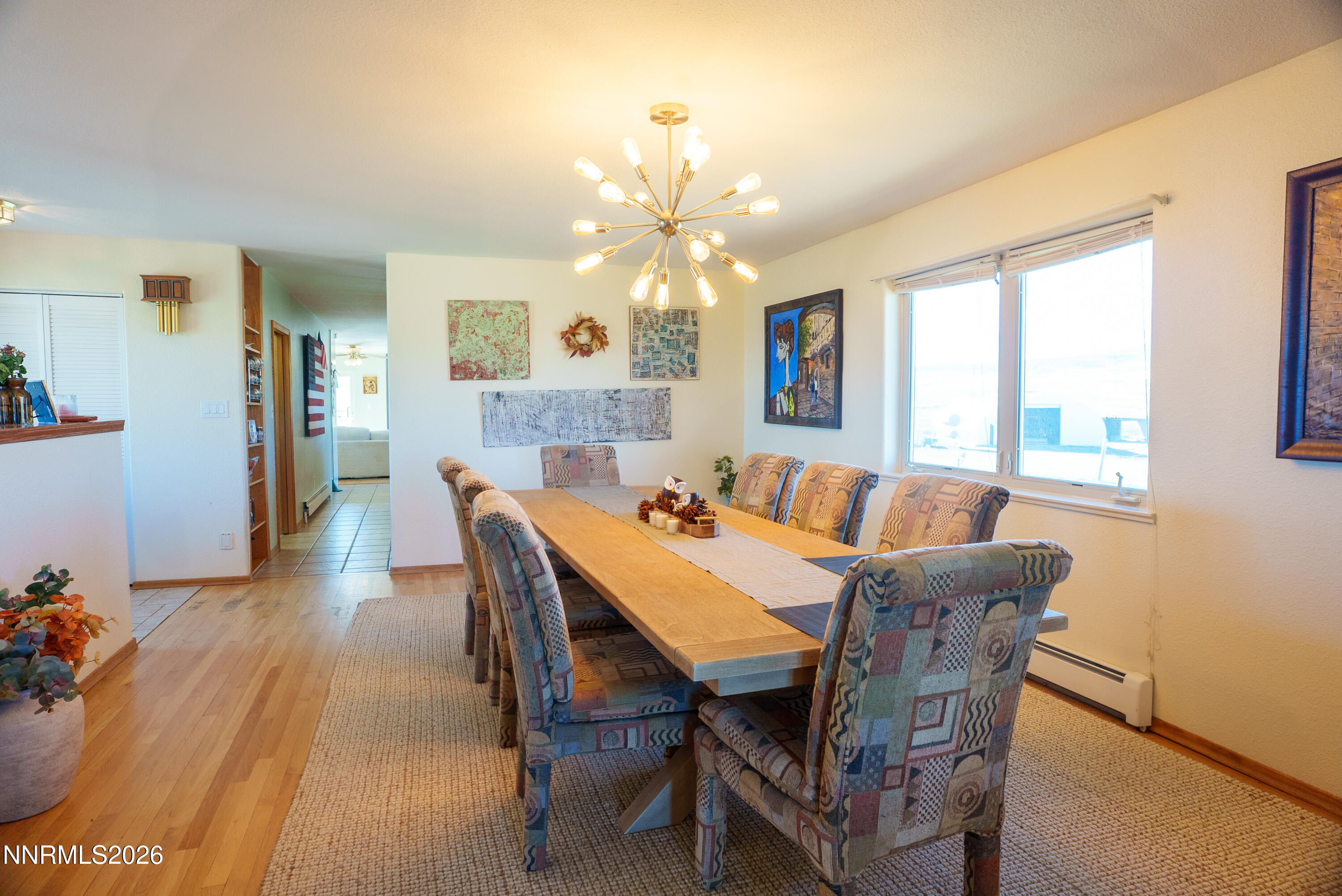 12000 North Red Rock Road Reno, NV 89508 - Photo 24 of 34 a view of a a dining room with furniture window and wooden floor
