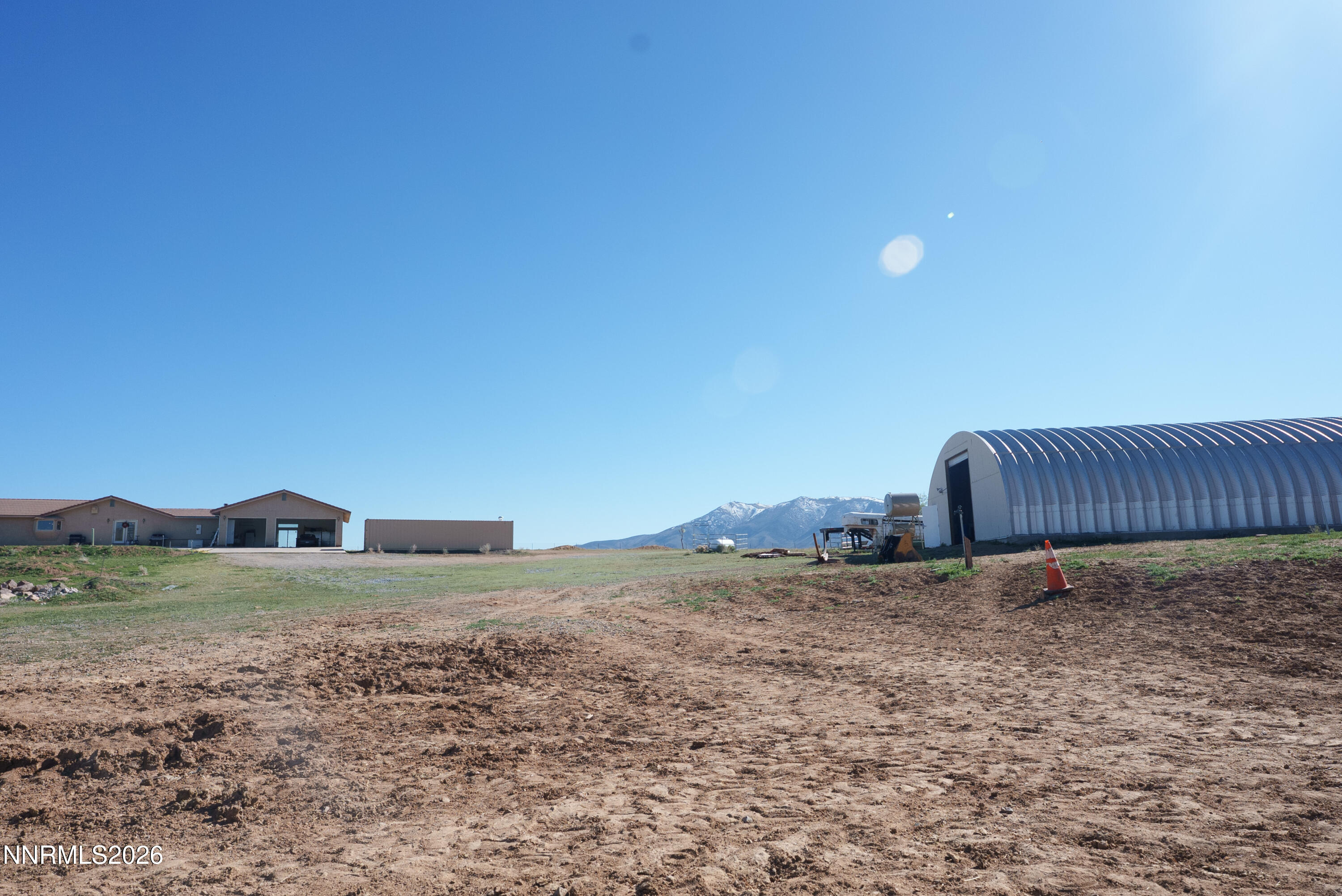 12000 North Red Rock Road Reno, NV 89508 - Photo 4 of 18 a view of a dry yard with wooden fence