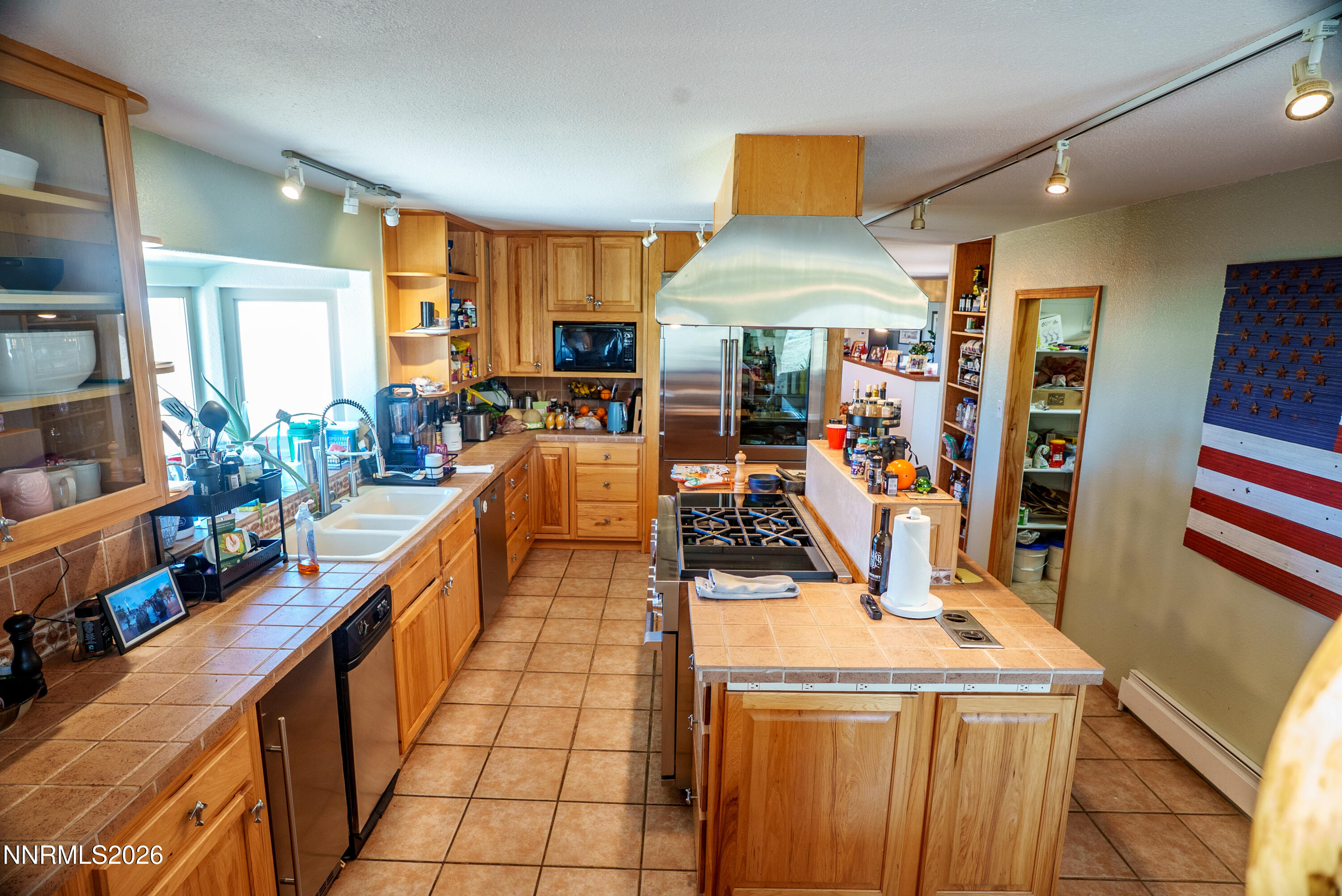12000 North Red Rock Road Reno, NV 89508 - Photo 9 of 18 a view of a kitchen with furniture and a large window
