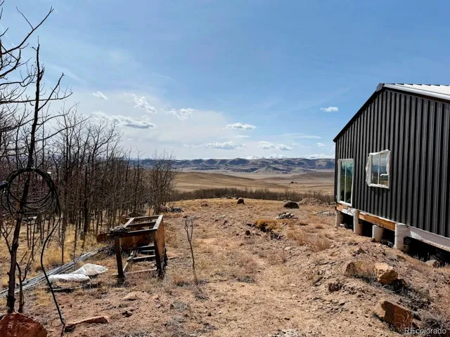 a view of a terrace with wooden fence