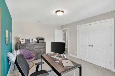 a workspace with furniture and window