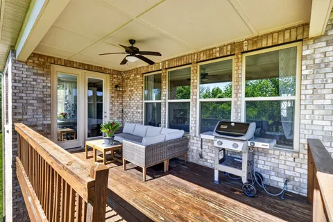 a outdoor space with patio the couches and a dining table with garden view