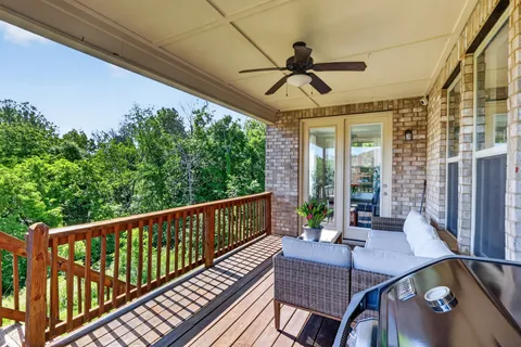 a view of a balcony filled with furniture