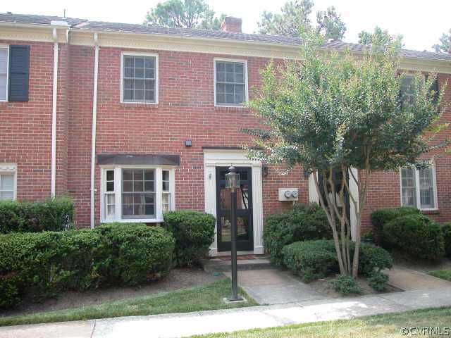 9109 Derbyshire Road, Unit D Richmond, VA 23229 - Photo 1 of 1 a front view of a house with garden