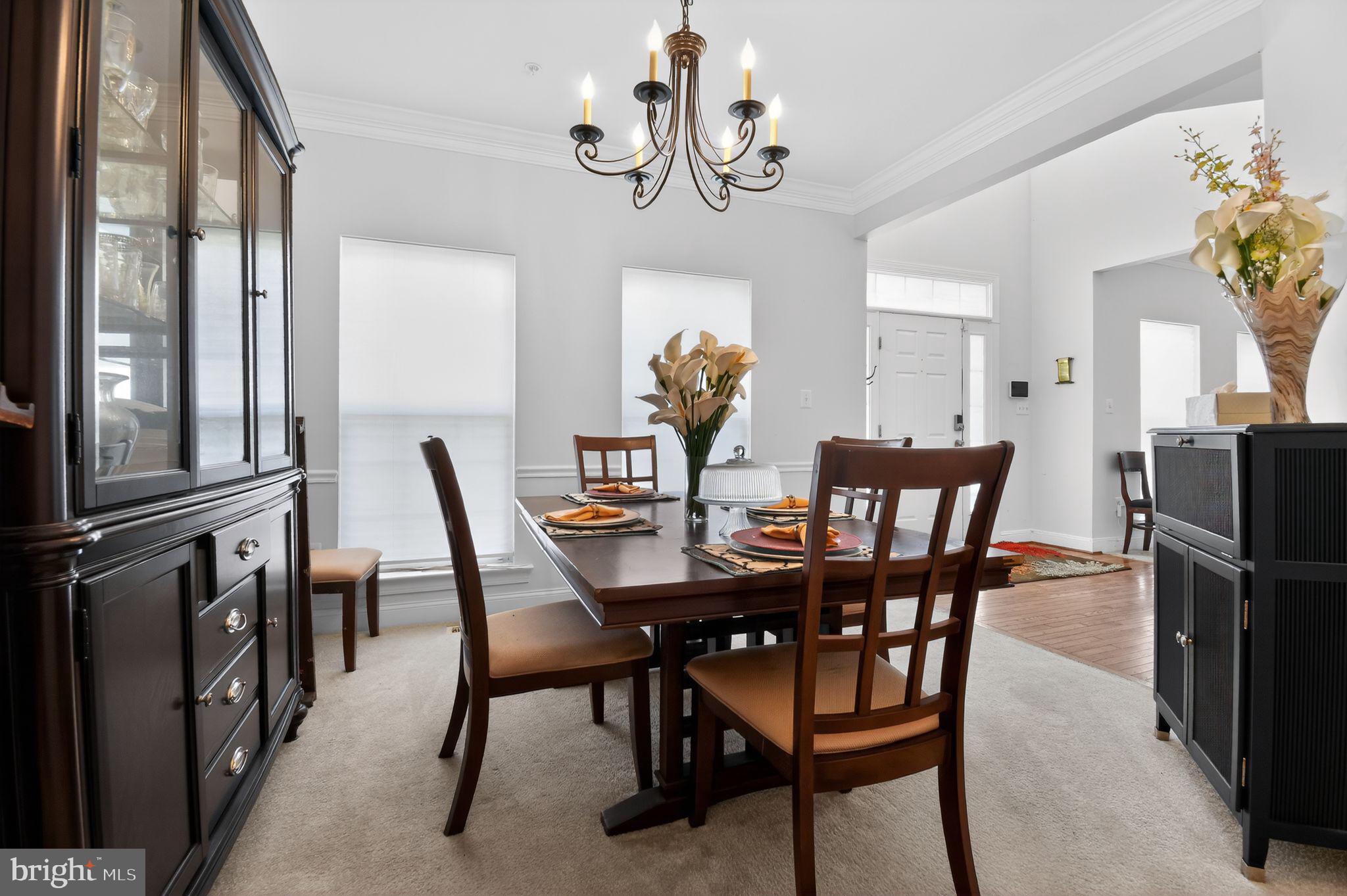 9009 Eldon Drive Clinton, MD 20735 - Photo 17 of 40 a view of a dining room with furniture and chandelier