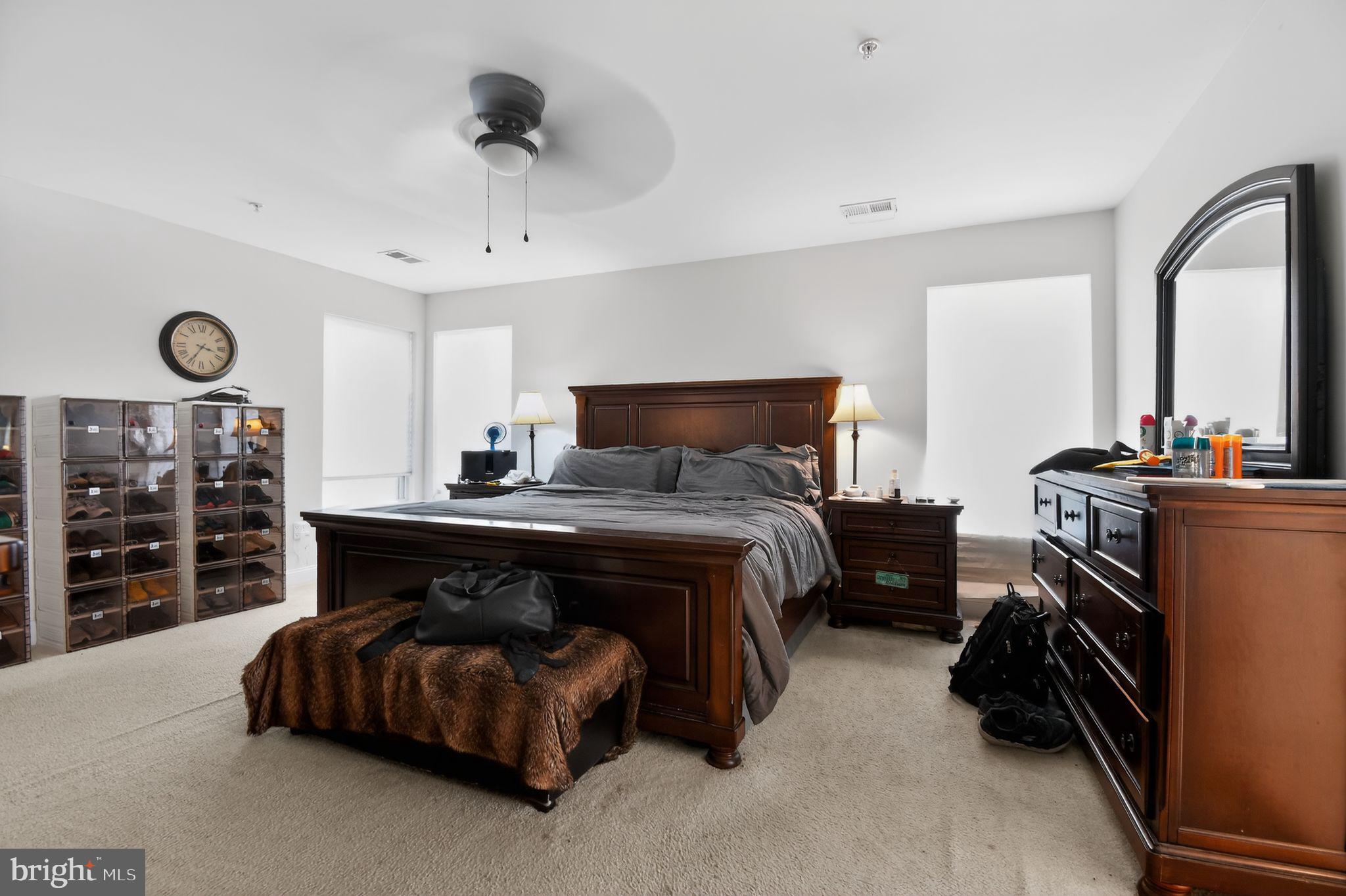 9009 Eldon Drive Clinton, MD 20735 - Photo 20 of 40 a bedroom with bed and a chandelier