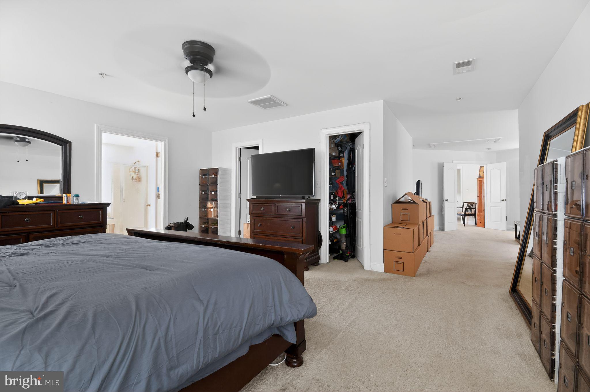 9009 Eldon Drive Clinton, MD 20735 - Photo 24 of 40 a bedroom with a bed and a flat screen tv