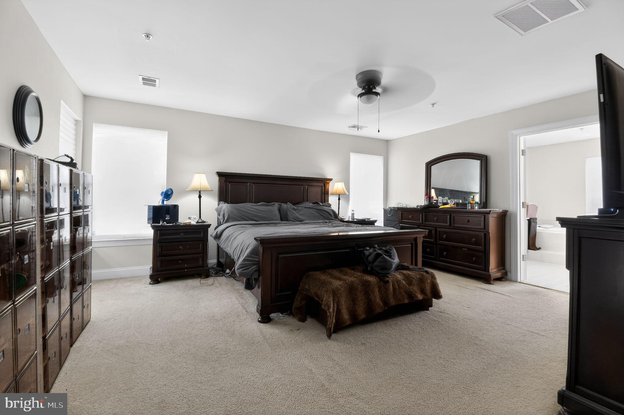9009 Eldon Drive Clinton, MD 20735 - Photo 25 of 40 a bedroom with a bed and a television
