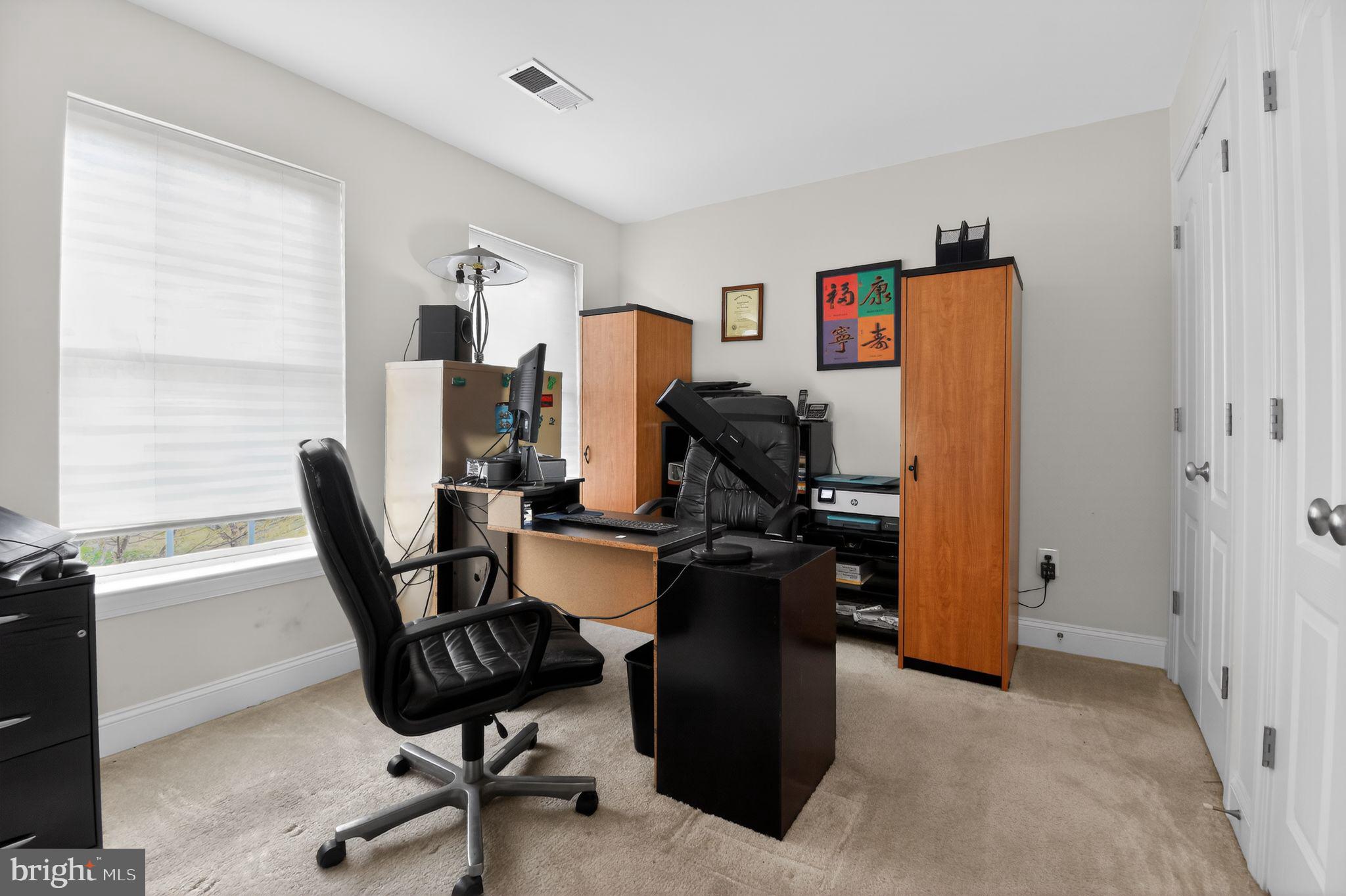 9009 Eldon Drive Clinton, MD 20735 - Photo 37 of 40 a view of a workspace with furniture and a window