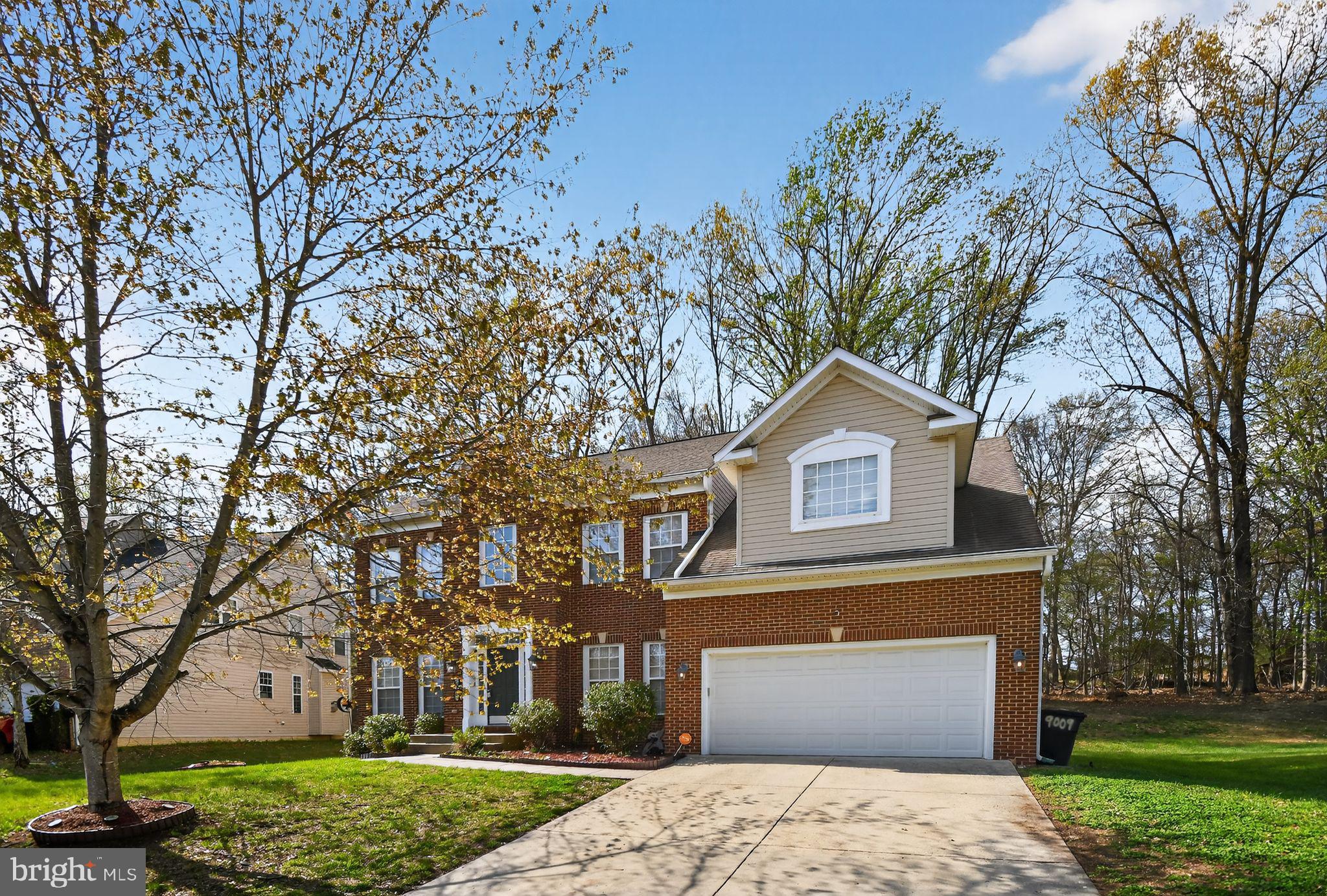 9009 Eldon Drive Clinton, MD 20735 - Photo 6 of 40 front view of a house with a yard