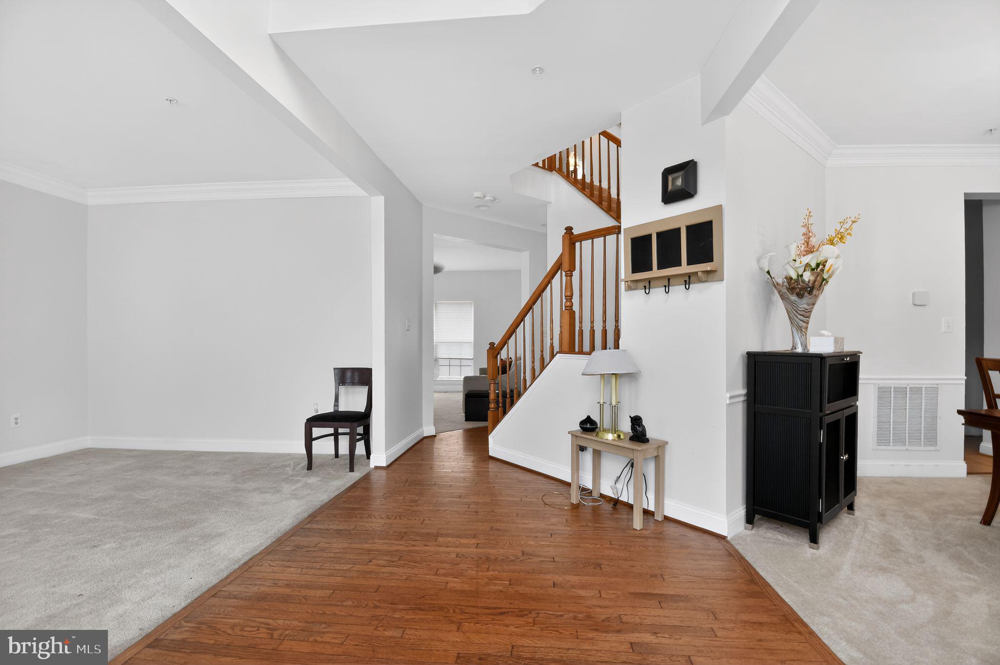 9009 Eldon Drive Clinton, MD 20735 - Photo 7 of 40 a view of entryway and hall with wooden floor