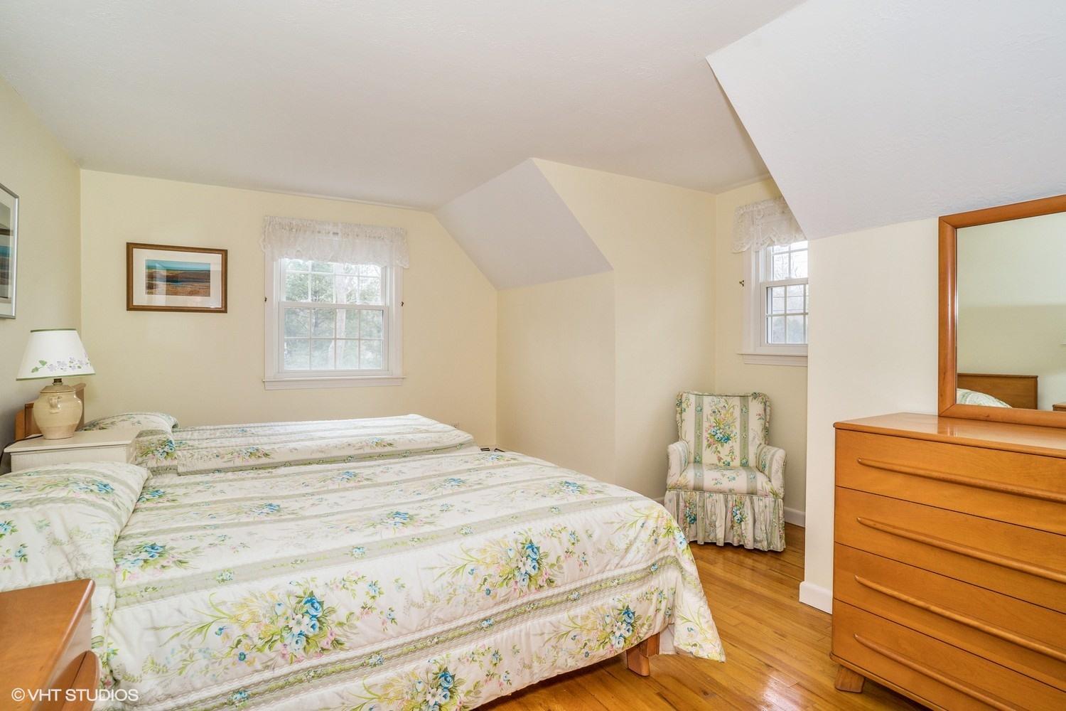 50 Deerfield Road Osterville, MA 02655 - Photo 12 of 14 a bedroom with a bed and a dresser