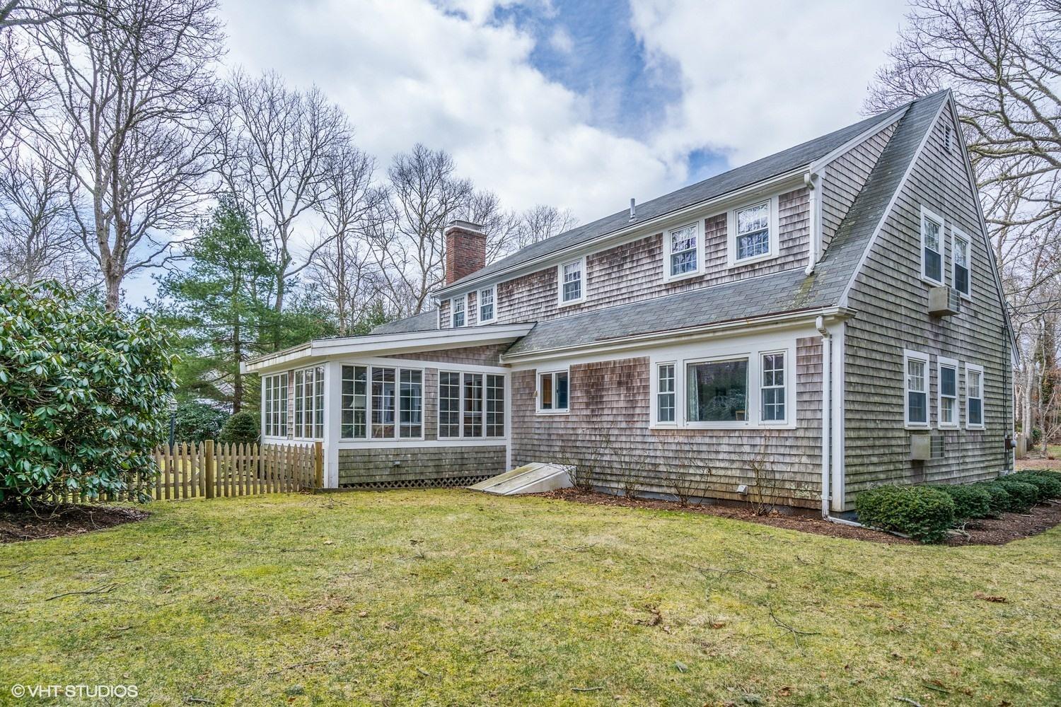 50 Deerfield Road Osterville, MA 02655 - Photo 14 of 14 a front view of a house with a garden