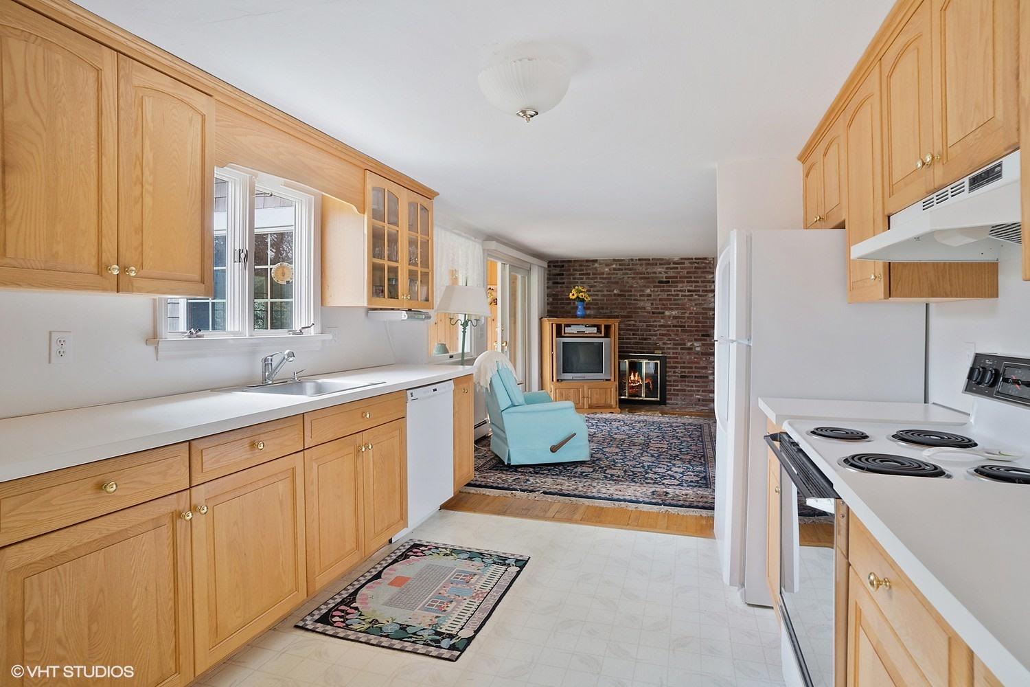 50 Deerfield Road Osterville, MA 02655 - Photo 5 of 14 a kitchen with stainless steel appliances granite countertop a sink stove and cabinets