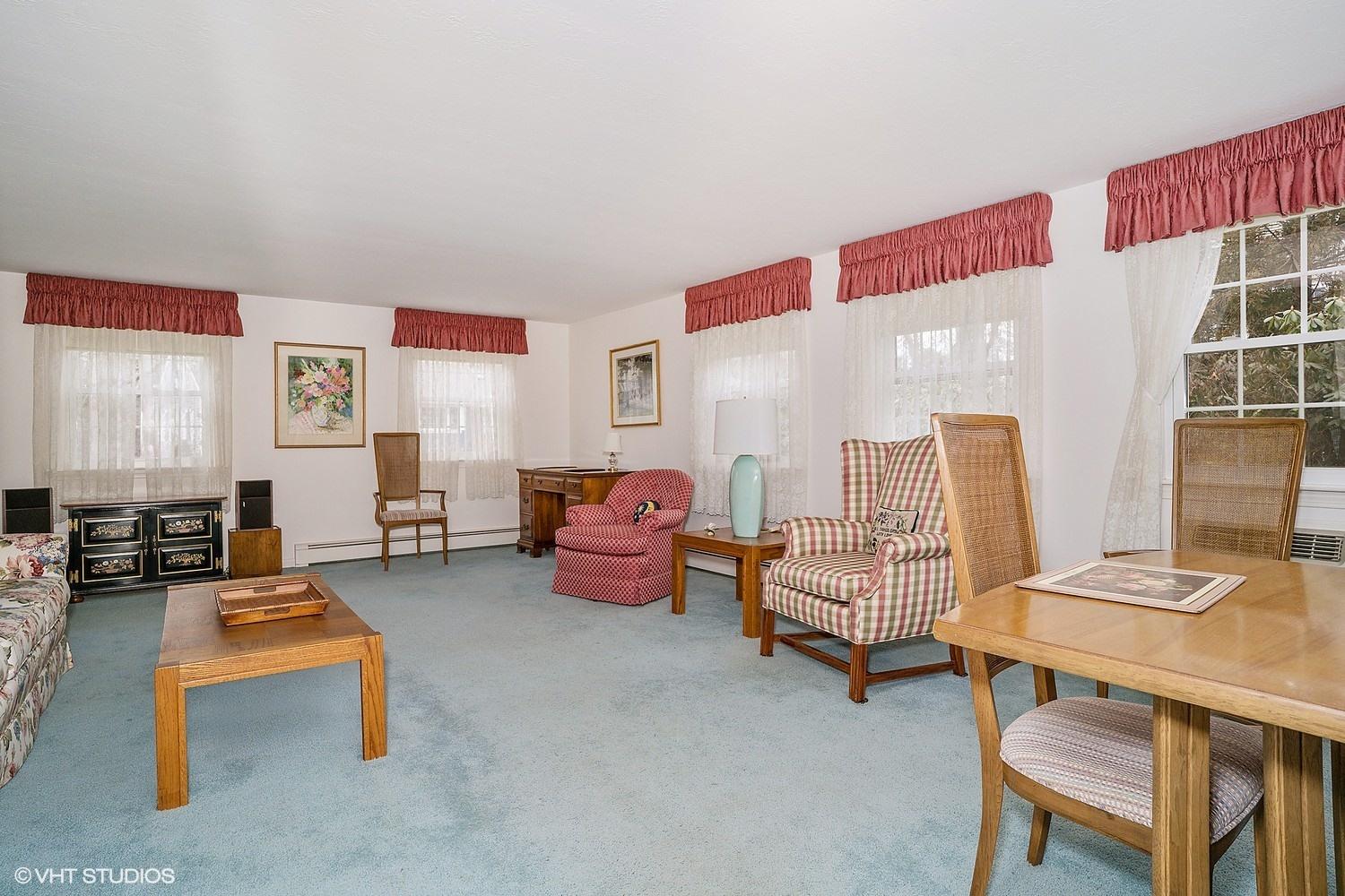 50 Deerfield Road Osterville, MA 02655 - Photo 7 of 14 a living room with furniture and a table
