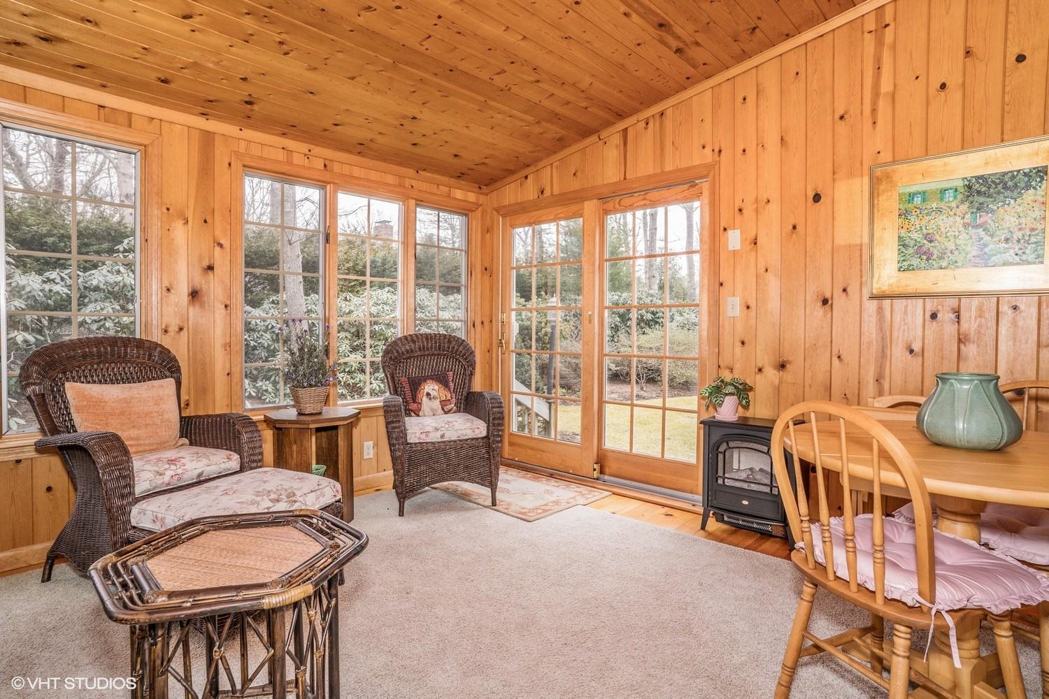 50 Deerfield Road Osterville, MA 02655 - Photo 8 of 14 a living room with furniture and a floor to ceiling window