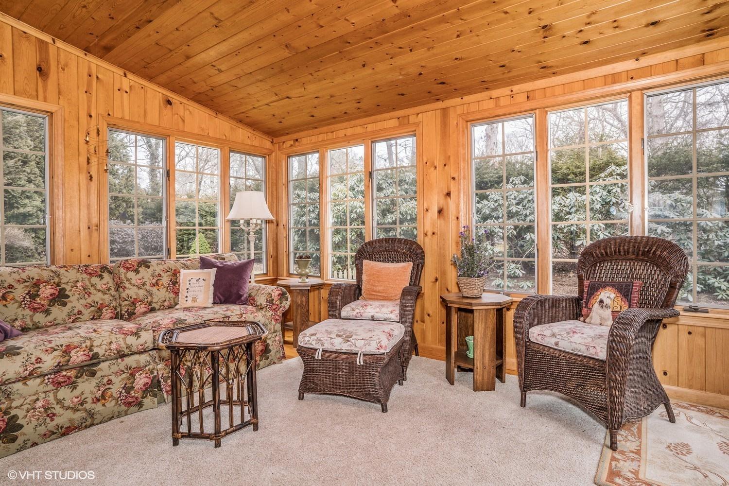 50 Deerfield Road Osterville, MA 02655 - Photo 9 of 14 a living room with furniture and a floor to ceiling window
