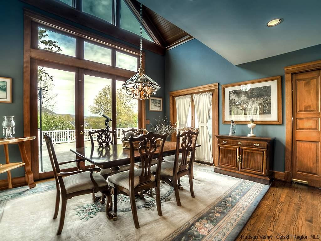 47 Saddleback Ridge Road Wallkill, NY 12589 - Photo 9 of 32 a view of a dining room with furniture large windows and wooden floor