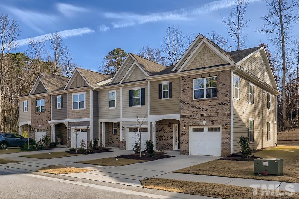 2557 Rambling Creek Road Apex, NC 27523 - Photo 1 of 27 a front view of a house with yard
