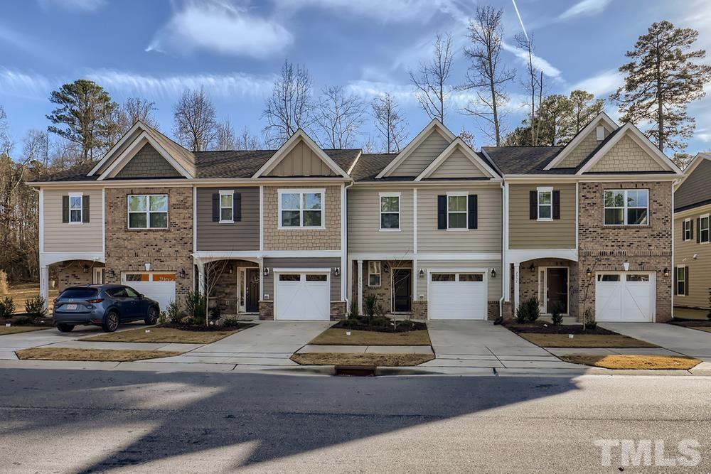 2557 Rambling Creek Road Apex, NC 27523 - Photo 2 of 27 a front view of a house with a yard