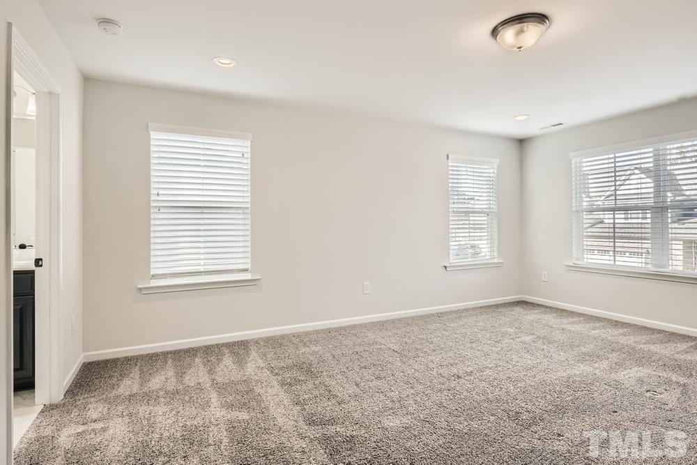 2557 Rambling Creek Road Apex, NC 27523 - Photo 12 of 27 a view of an empty room with a window