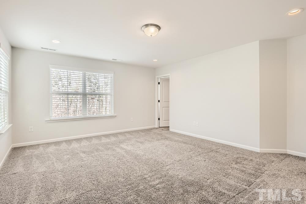 2557 Rambling Creek Road Apex, NC 27523 - Photo 13 of 27 an empty room with windows