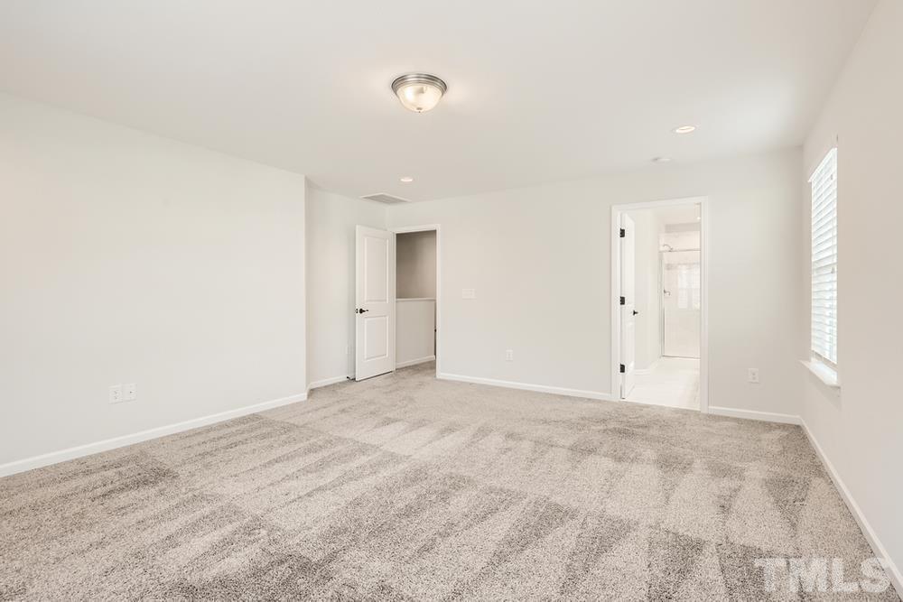 2557 Rambling Creek Road Apex, NC 27523 - Photo 14 of 27 a view of an empty room