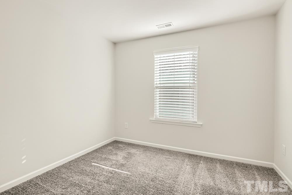 2557 Rambling Creek Road Apex, NC 27523 - Photo 16 of 27 an empty room with a window