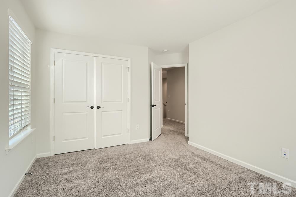 2557 Rambling Creek Road Apex, NC 27523 - Photo 19 of 27 a view of an empty room