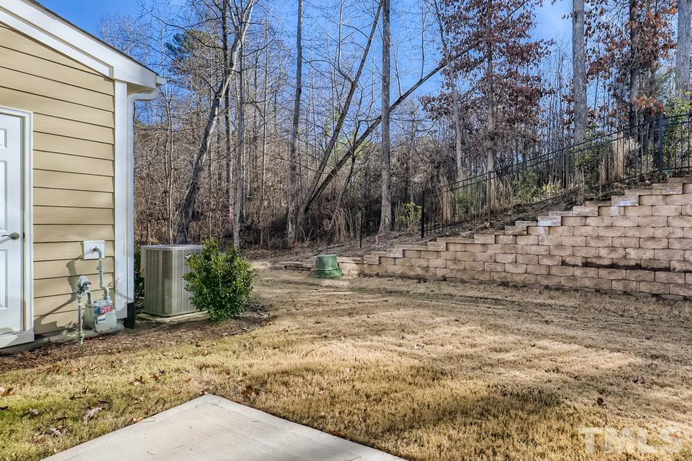 2557 Rambling Creek Road Apex, NC 27523 - Photo 24 of 27 a view of a yard with trees
