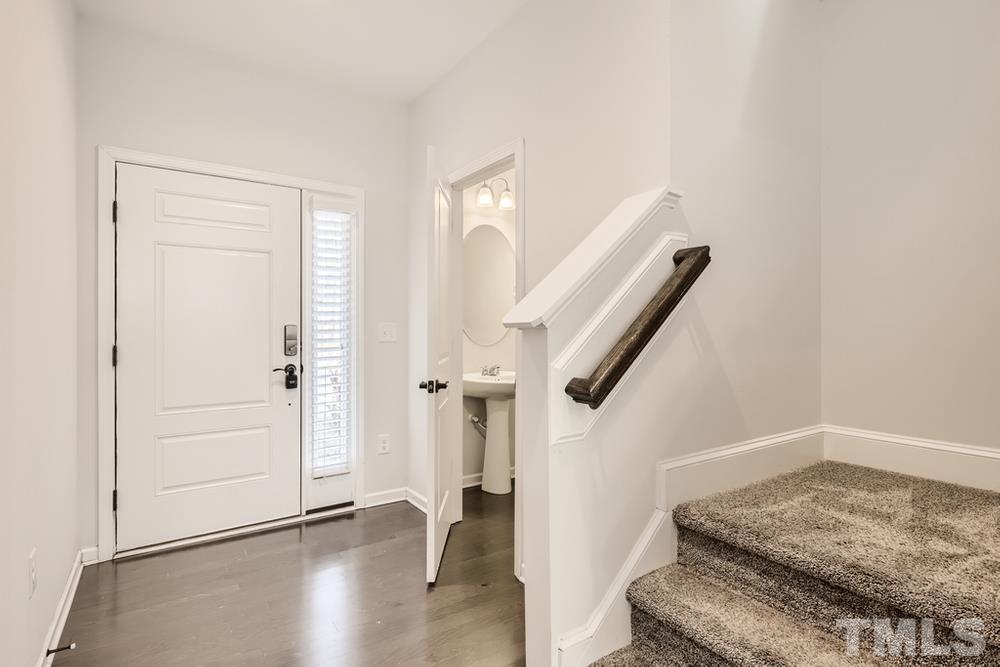 2557 Rambling Creek Road Apex, NC 27523 - Photo 4 of 27 a view of entryway with wooden floor