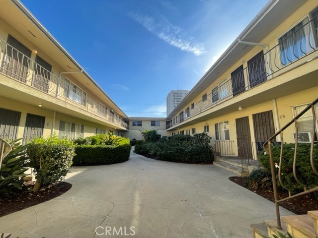 728 Cedar Avenue, Unit 18 Long Beach, CA 90813 - Photo 2 of 7 a front view of a building with garden