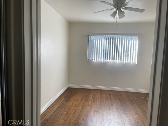 728 Cedar Avenue, Unit 18 Long Beach, CA 90813 - Photo 5 of 7 wooden floor in an empty room with a window