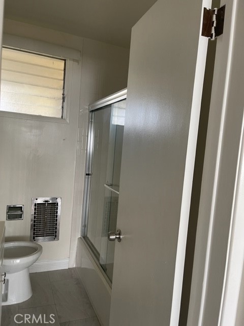 728 Cedar Avenue, Unit 18 Long Beach, CA 90813 - Photo 6 of 7 a bathroom with a toilet and a shower