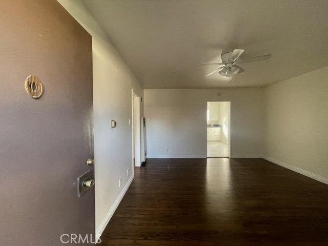 728 Cedar Avenue, Unit 18 Long Beach, CA 90813 - Photo 7 of 7 a view of empty room with wooden floor and fan