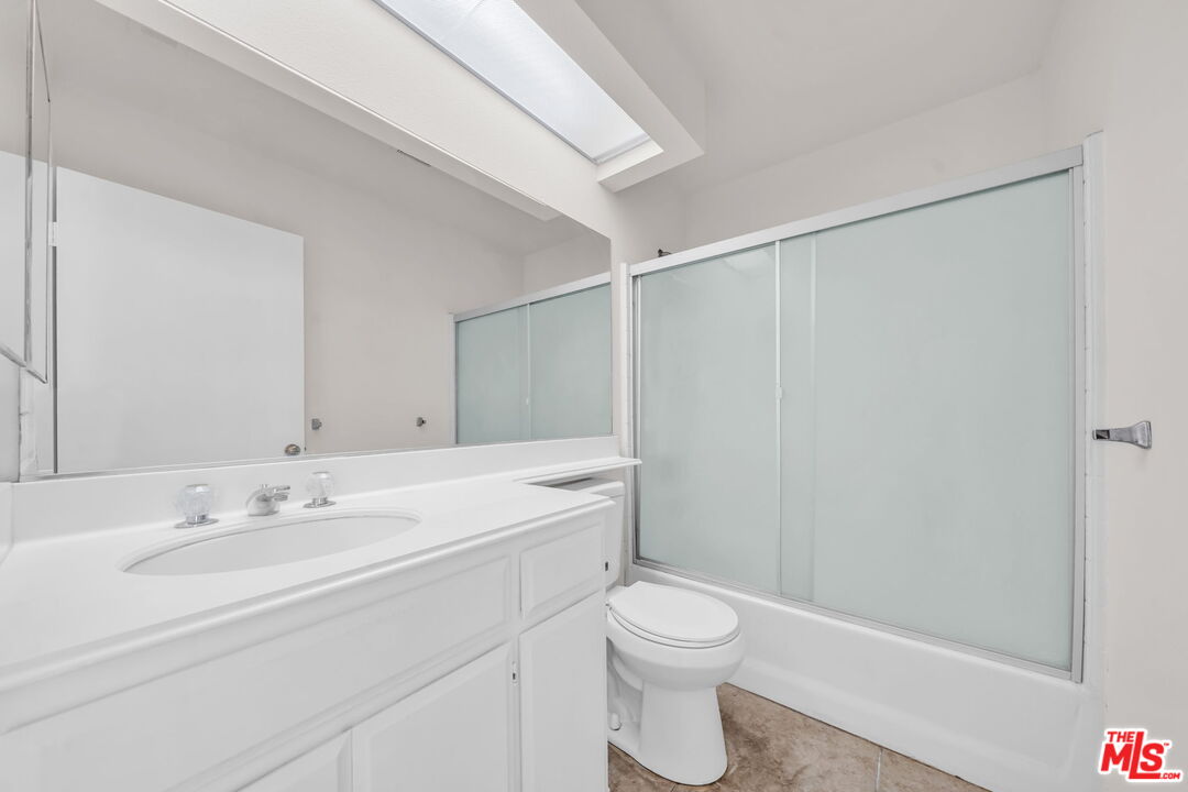 820 West Compton Boulevard, Unit 17 Compton, CA 90220 - Photo 23 of 50 a bathroom with a sink a toilet and a mirror