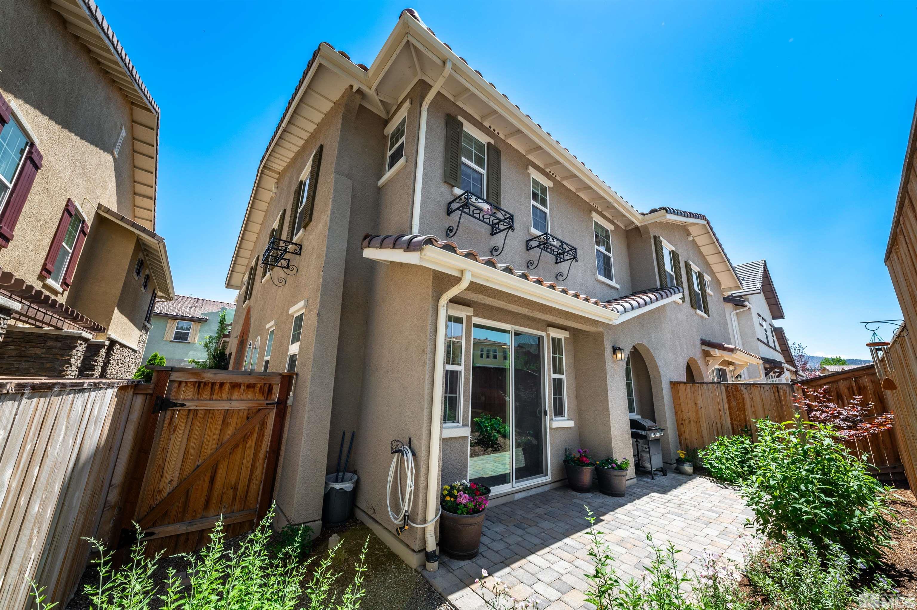 1825 Sea Horse Road, Unit C Reno, NV 89521 - Photo 1 of 24 a view of a building with many windows