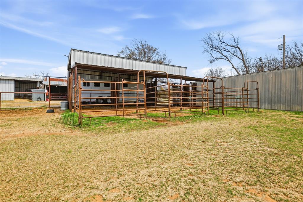309 Sanders Road Denton, TX 76210 - Photo 34 of 40 a view of a house with a backyard