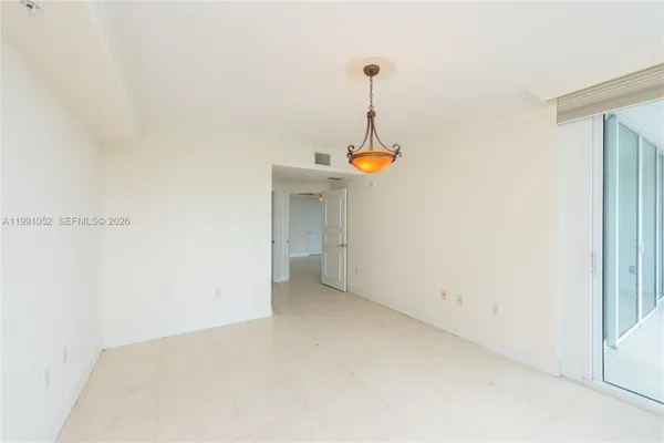 a view of closet area with empty racks