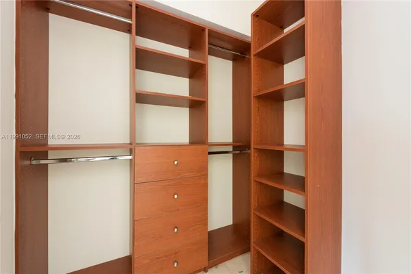 a view of a hallway with a wooden door