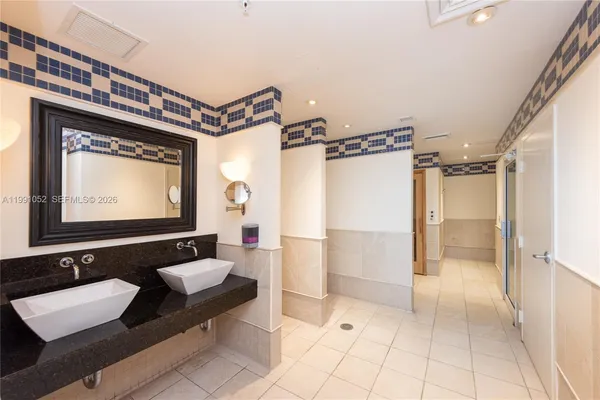 a view of a balcony with wooden floor and a sink