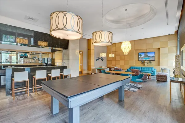 a lobby with furniture and mirror